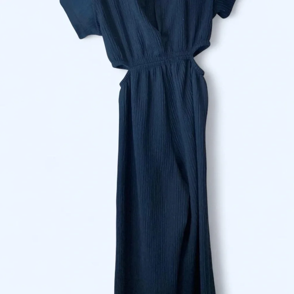 Navy blue jumpsuit with keyhole middle and open sides back slit as well girls 9